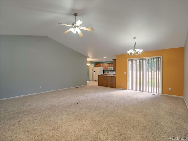 1436 H St Unit D, Salida, CO 81201 - unfurnished living room with a chandelier, vaulted ceiling, a ceiling fan, and light colored carpet