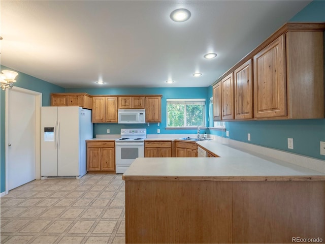 1436 H St Unit D, Salida, CO 81201 - kitchen featuring white appliances, light countertops, a peninsula, light floors, and a chandelier