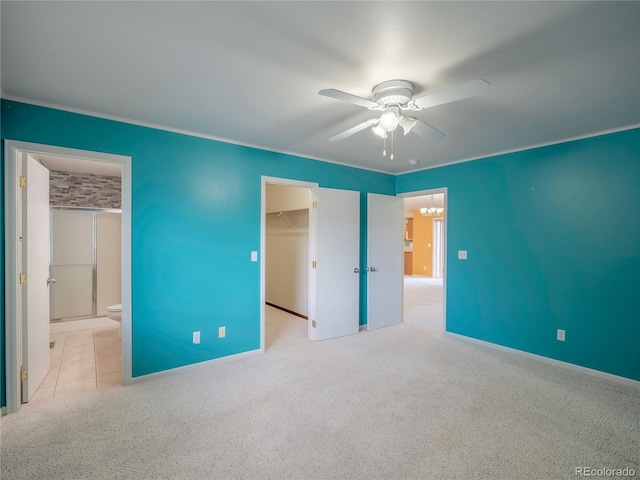 1436 H St Unit D, Salida, CO 81201 - unfurnished bedroom with carpet flooring, a walk in closet, a closet, ensuite bath, and a ceiling fan