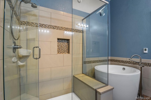 bathroom featuring tile walls and plus walk in shower