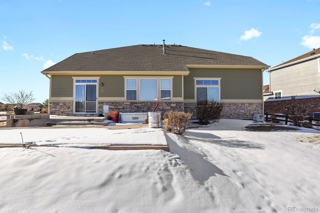 view of snow covered house