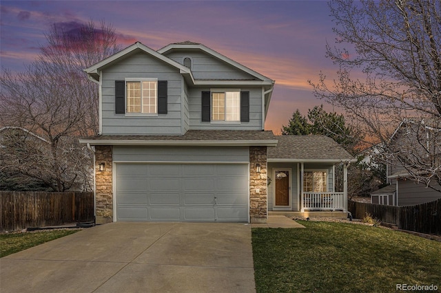23813 Broadmoor Dr, Parker, CO 80138 - traditional-style house featuring stone siding, covered porch, a garage, fence, and concrete driveway