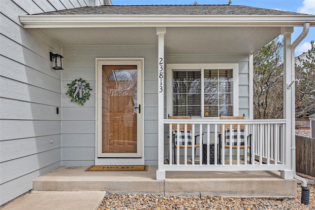 23813 Broadmoor Dr, Parker, CO 80138 - doorway to property with a porch and a shingled roof