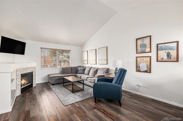 23813 Broadmoor Dr, Parker, CO 80138 - living area with dark wood-type flooring, a stone fireplace, and baseboards