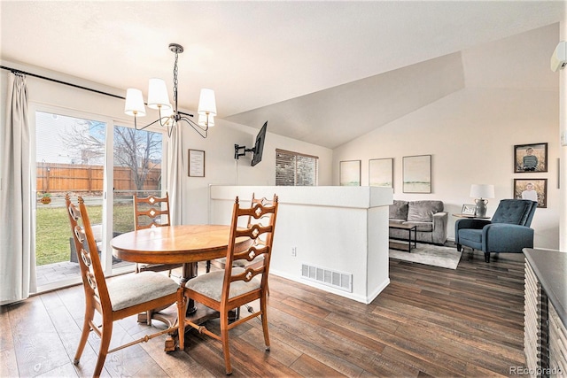 23813 Broadmoor Dr, Parker, CO 80138 - dining area featuring visible vents, dark wood-style flooring, an inviting chandelier, and lofted ceiling