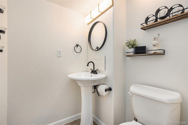 23813 Broadmoor Dr, Parker, CO 80138 - bathroom featuring toilet and baseboards