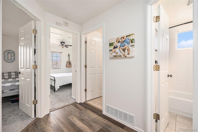 23813 Broadmoor Dr, Parker, CO 80138 - hallway featuring visible vents and wood finished floors