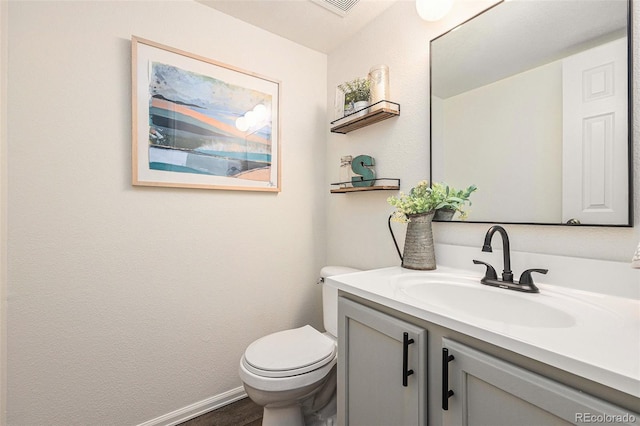 23813 Broadmoor Dr, Parker, CO 80138 - bathroom featuring toilet, wood finished floors, vanity, and baseboards