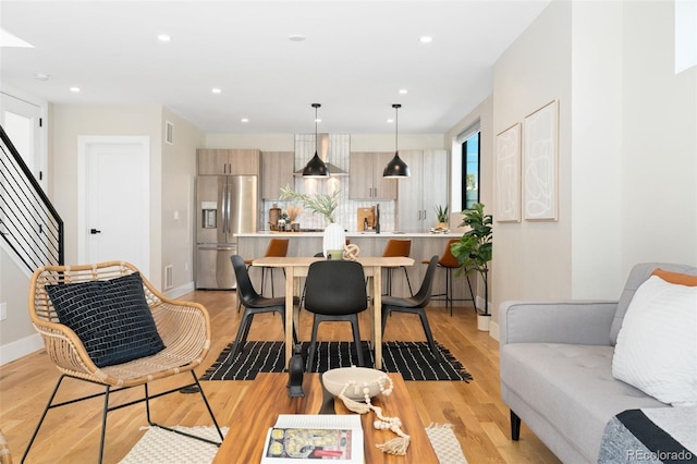 dining area featuring baseboards, recessed lighting, light wood-style flooring, and visible vents