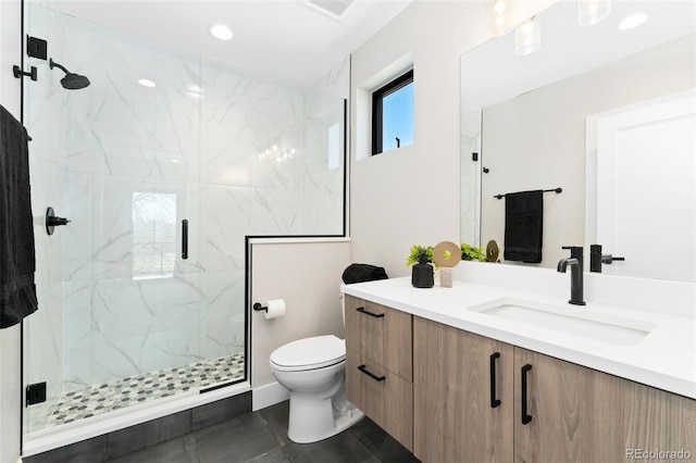 full bathroom featuring tile patterned floors, vanity, toilet, a marble finish shower, and recessed lighting