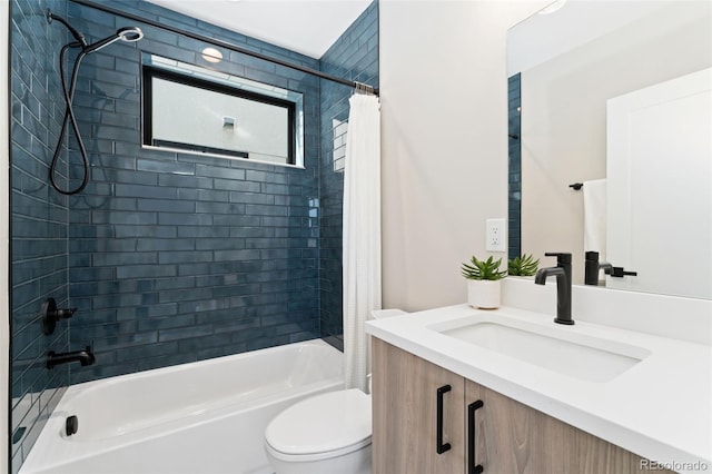 bathroom with vanity, toilet, and shower / tub combo