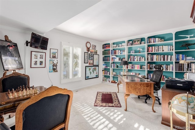 carpeted office space with ornamental molding