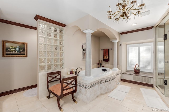 bathroom with decorative columns, tiled bath, tile patterned flooring, and a notable chandelier