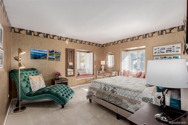 carpeted bedroom featuring multiple windows