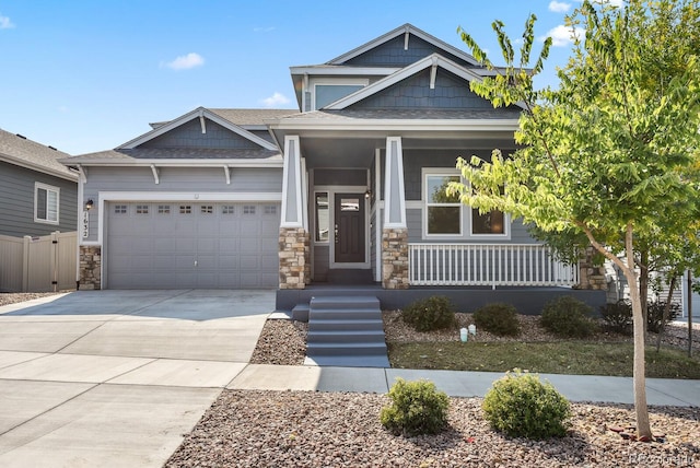 craftsman-style house with covered porch and a garage