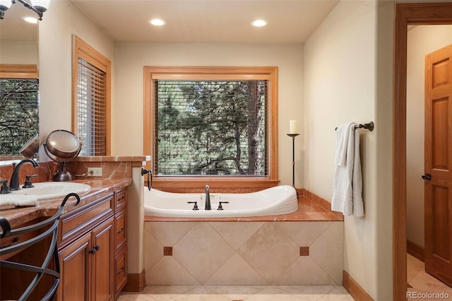 20050 Lost Arrowhead Dr, Monument, CO 80132 - full bath with plenty of natural light, a bath, vanity, tile patterned flooring, and recessed lighting