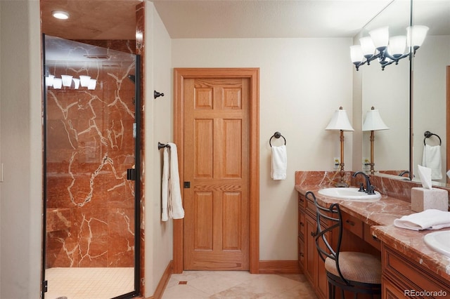 20050 Lost Arrowhead Dr, Monument, CO 80132 - bathroom featuring a marble finish shower, vanity, baseboards, and tile patterned flooring