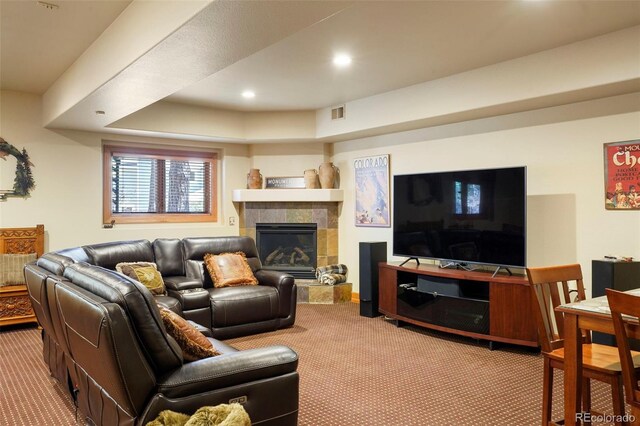 20050 Lost Arrowhead Dr, Monument, CO 80132 - living area with carpet flooring, a tiled fireplace, and recessed lighting