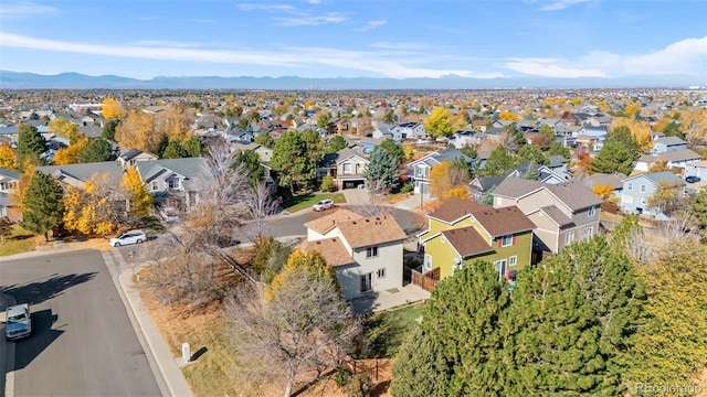 birds eye view of property featuring a mountain view