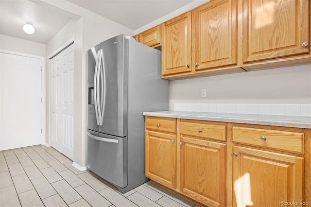 kitchen with stainless steel fridge with ice dispenser