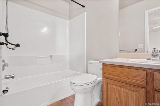 full bathroom with vanity, toilet, shower / bathing tub combination, and wood-type flooring