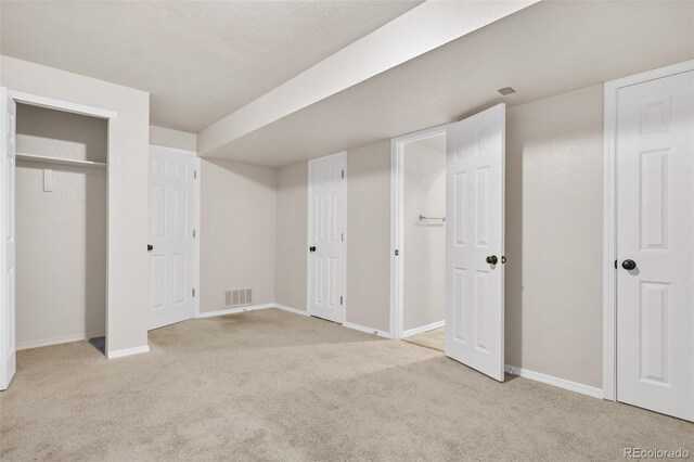 unfurnished bedroom with light carpet