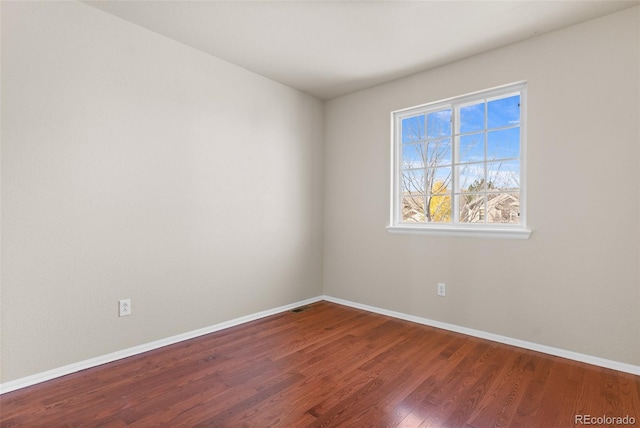 empty room featuring hardwood / wood-style flooring