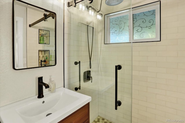 bathroom with vanity and walk in shower