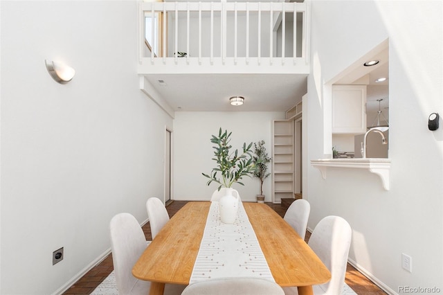 2049 Sussex Ln, Colorado Springs, CO 80909 - dining space with baseboards and a towering ceiling