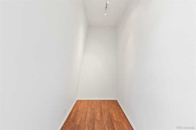 2049 Sussex Ln, Colorado Springs, CO 80909 - hallway with wood finished floors and baseboards
