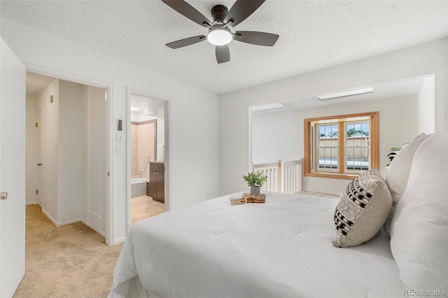 2049 Sussex Ln, Colorado Springs, CO 80909 - bedroom featuring light carpet, connected bathroom, a textured ceiling, and ceiling fan