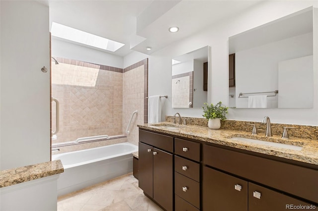 2049 Sussex Ln, Colorado Springs, CO 80909 - full bath with a skylight, double vanity, and recessed lighting