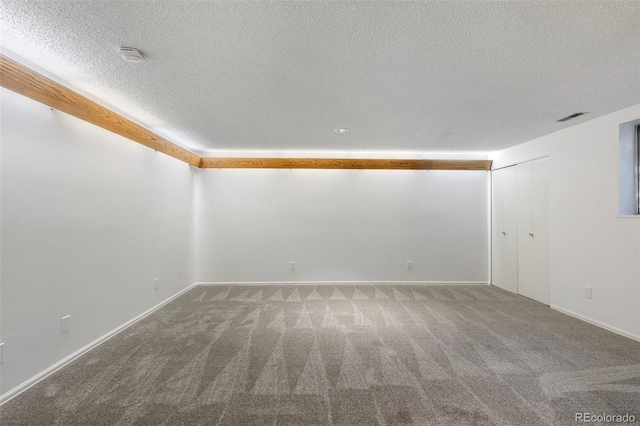 2049 Sussex Ln, Colorado Springs, CO 80909 - carpeted spare room with a textured ceiling and a smoke detector