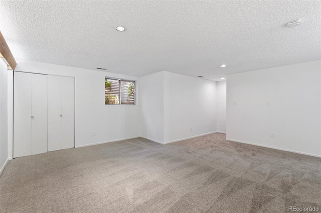 2049 Sussex Ln, Colorado Springs, CO 80909 - unfurnished bedroom featuring a textured ceiling, carpet flooring, and recessed lighting