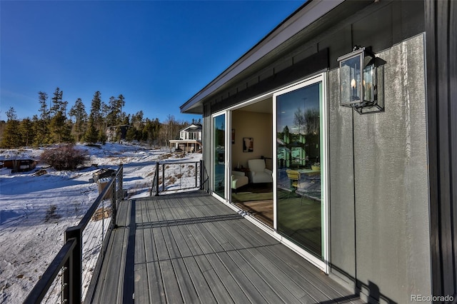 view of snow covered deck