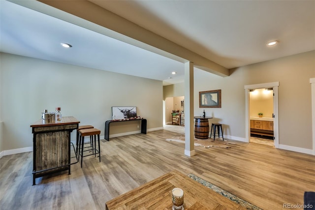 sitting room featuring baseboards, recessed lighting, and light wood-style floors