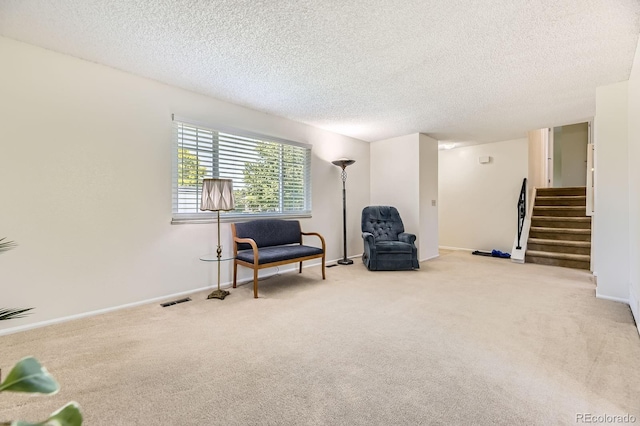 6348 S Independence St, Littleton, CO 80123 - living area with a textured ceiling, carpet floors, and stairway