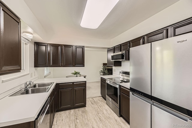 6348 S Independence St, Littleton, CO 80123 - kitchen with stainless steel appliances, light countertops, and dark brown cabinets
