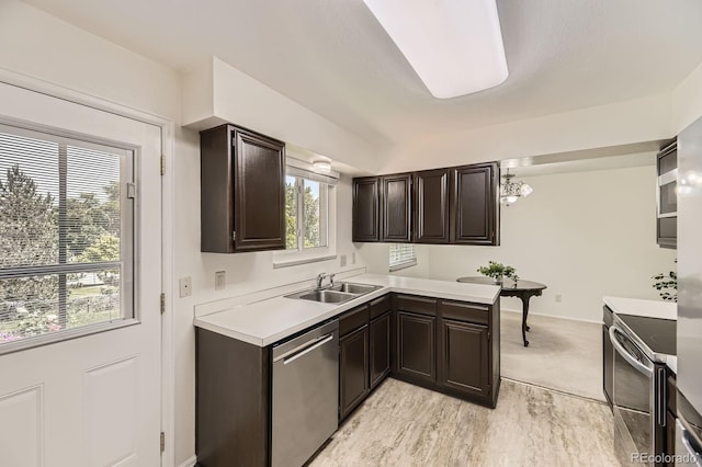 6348 S Independence St, Littleton, CO 80123 - kitchen with stainless steel appliances, light countertops, and dark brown cabinets