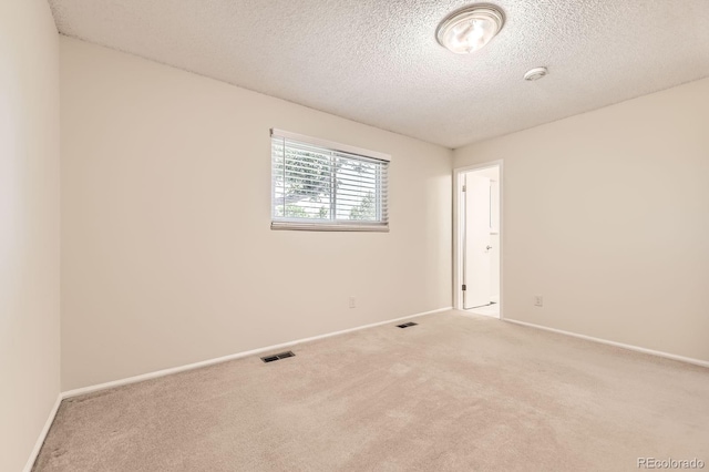 6348 S Independence St, Littleton, CO 80123 - carpeted spare room featuring a textured ceiling and a smoke detector