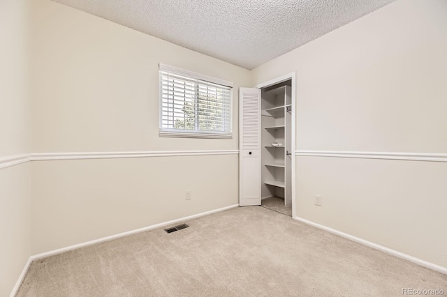 6348 S Independence St, Littleton, CO 80123 - unfurnished bedroom with carpet and a textured ceiling