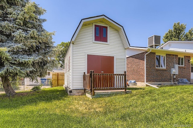 6348 S Independence St, Littleton, CO 80123 - rear view of property with a gambrel roof, brick siding, and an outbuilding