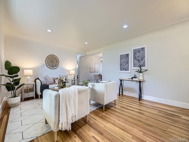 50 Yarrow St, Lakewood, CO 80226 - living room with light wood finished floors, baseboards, and recessed lighting