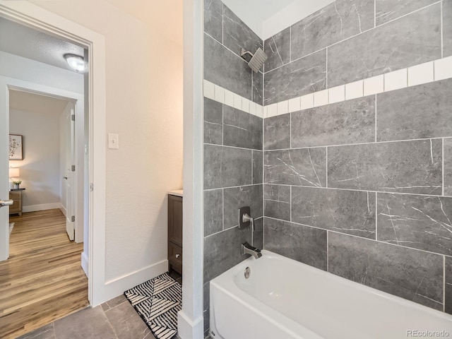 50 Yarrow St, Lakewood, CO 80226 - full bath featuring shower / bathtub combination, vanity, and baseboards