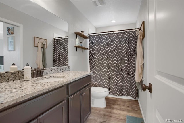 4391 S Nepal St, Centennial, CO 80015 - bathroom with vanity, toilet, wood finished floors, and curtained shower