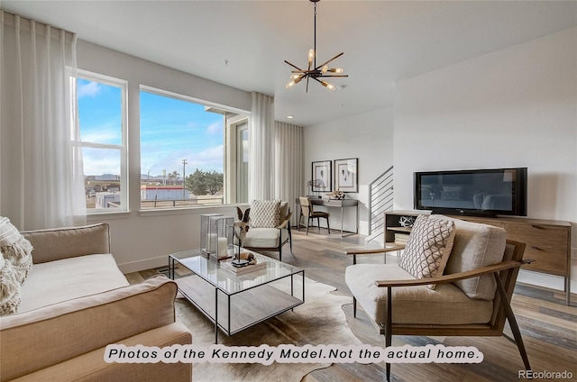 living room with a notable chandelier and hardwood / wood-style flooring