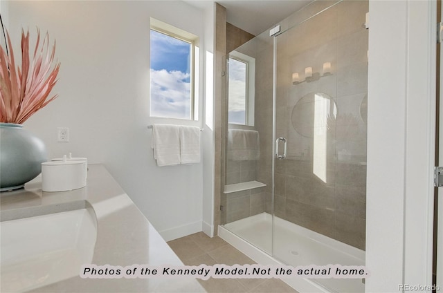 bathroom featuring an enclosed shower, vanity, and tile patterned flooring