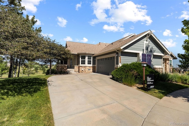 7713 S Zante Ct, Aurora, CO 80016 - ranch-style home featuring stone siding, an attached garage, driveway, and a front lawn