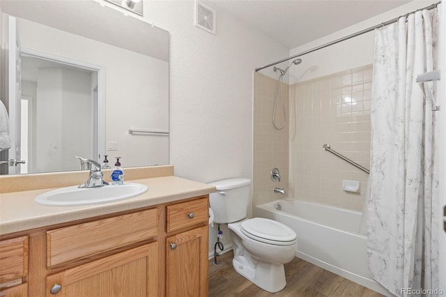 7713 S Zante Ct, Aurora, CO 80016 - full bathroom with shower / bath combo, vanity, and wood finished floors