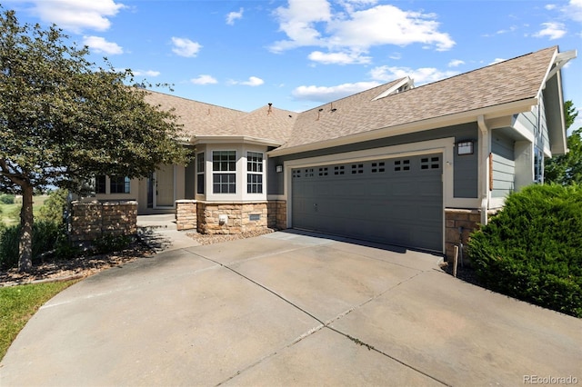 7713 S Zante Ct, Aurora, CO 80016 - single story home featuring stone siding, roof with shingles, driveway, and an attached garage